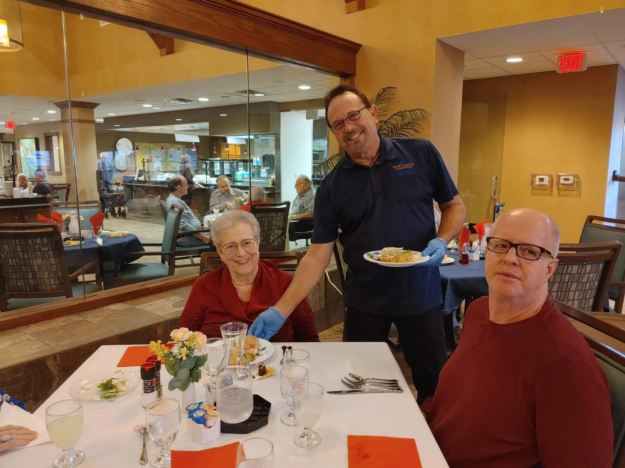 RLC waiter serving RLC residents