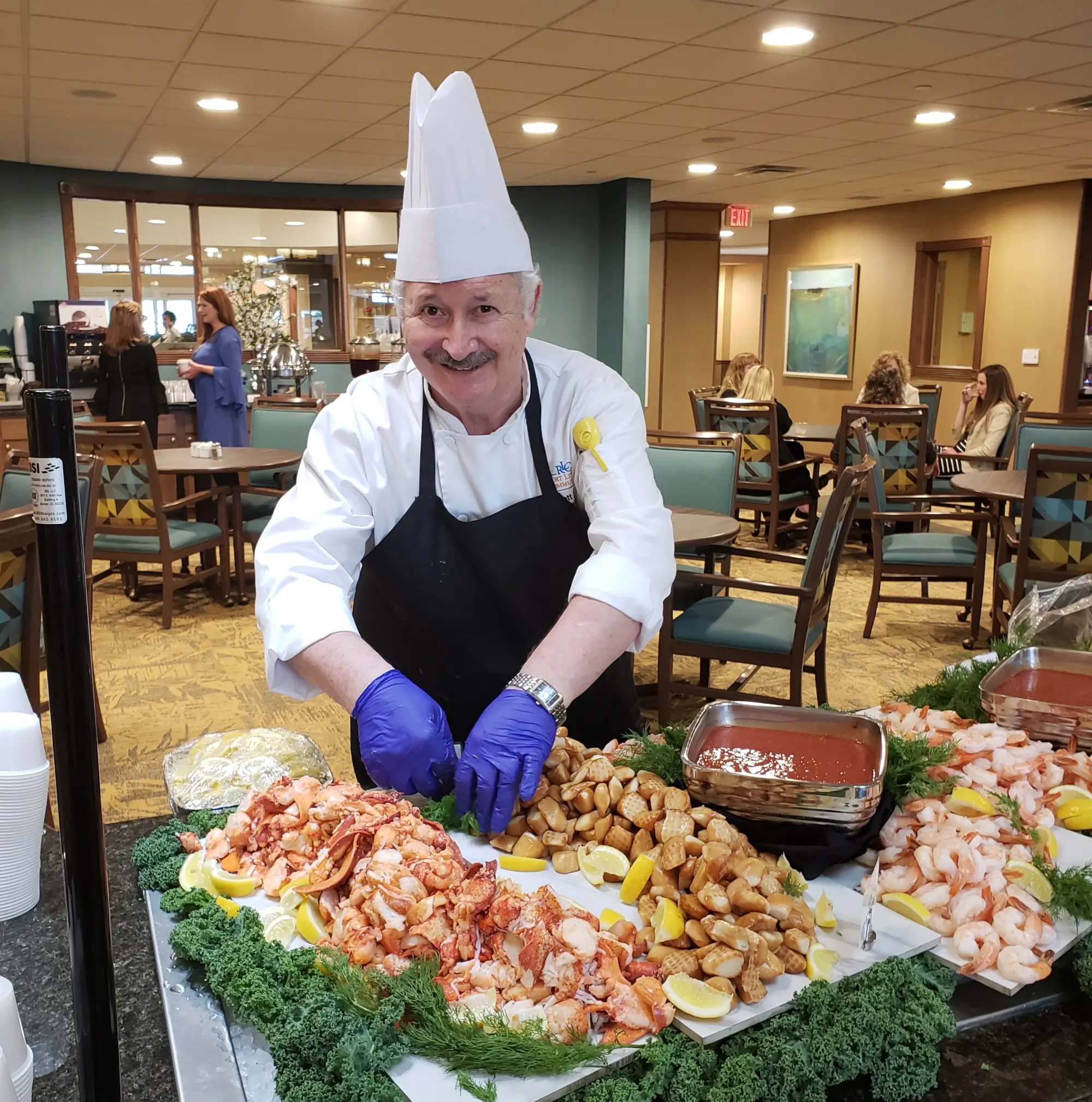 RLC chef putting out buffet meal
